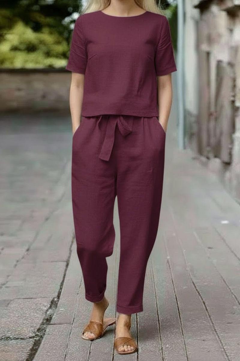 Women’s cotton linen set with relaxed short-sleeve top and straight-leg pants in monochrome maroon shade