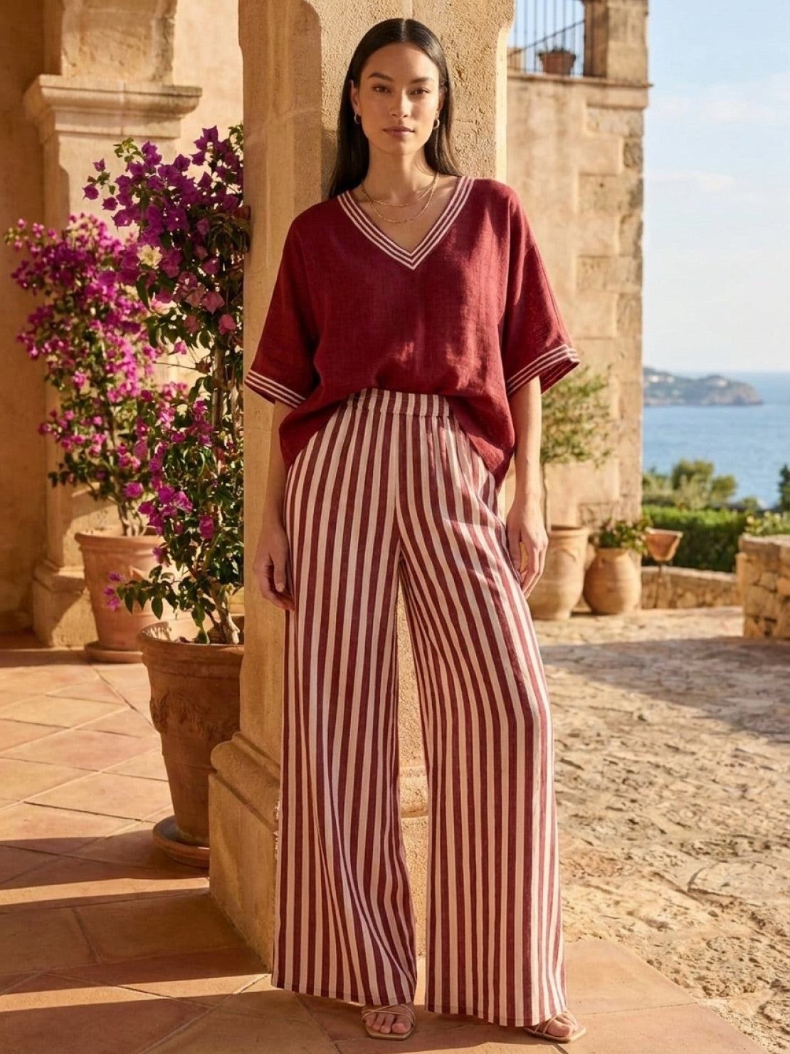 Woman wearing a striped wide-leg co-ord set with oversized top and palazzo pants