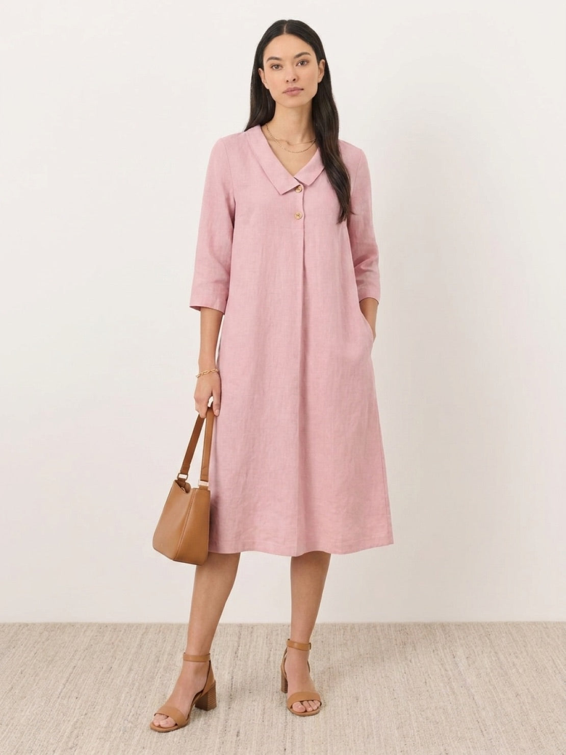 Navy linen-look midi dress with relaxed A-line silhouette, V-neckline, two-button chest detail, 3/4 sleeves, and side pockets