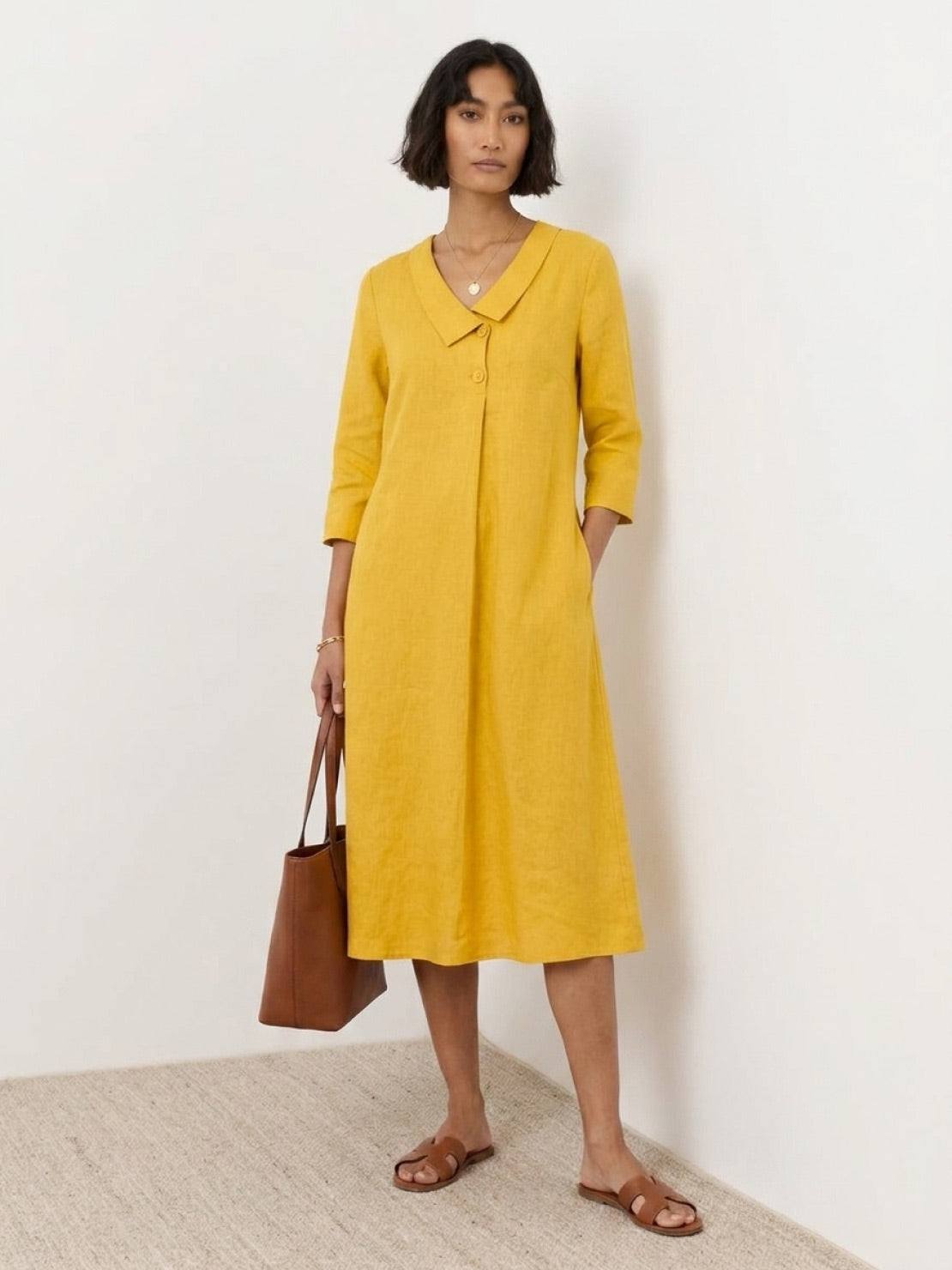 Linen-look midi dress with relaxed A-line fit, 3/4 sleeves, and side pockets