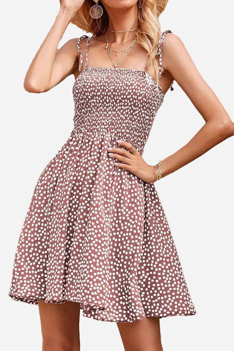 Bohemian skater dress with polka dot pattern, sling knot straps, and elastic top for a comfortable summer fit