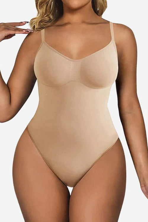 Beige seamless TummyToning Bodysuit with adjustable straps, tummy control, and chest lift for smooth, toned curves.