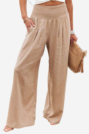 Beige high-waist palazzo pants with wide-leg fit and smocked waistband in lightweight cotton linen blend