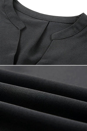 Close-up of black Dainty Charm Casual Ruffle Dress fabric and neckline details made of breathable polyester