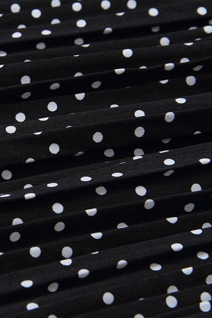 Close-up of black pleated fabric with white polka dots from Effortlessly Chic Polka Dot Pleated Skirt Set