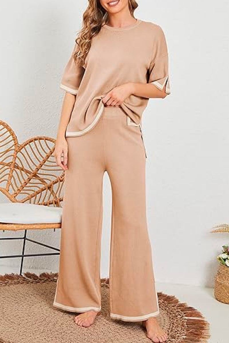 Woman wearing beige short sleeved relaxed fit lounge two-piece set with wide-leg pants and short sleeve top