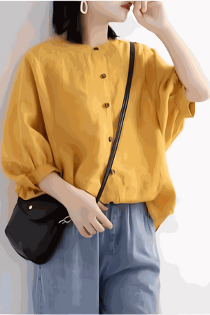 Relaxed loose breathable linen blouse in mustard yellow with button-down front and 3/4 sleeves