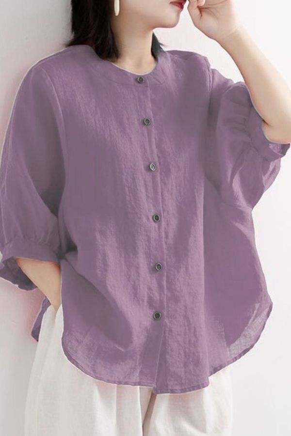 Relaxed loose breathable linen blouse in soft purple with button-down front and 3/4 sleeves for casual summer wear