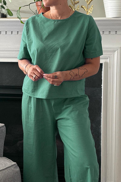 Green loose fit co-ord set with short sleeves and wide-leg trousers, relaxed casual outfit.