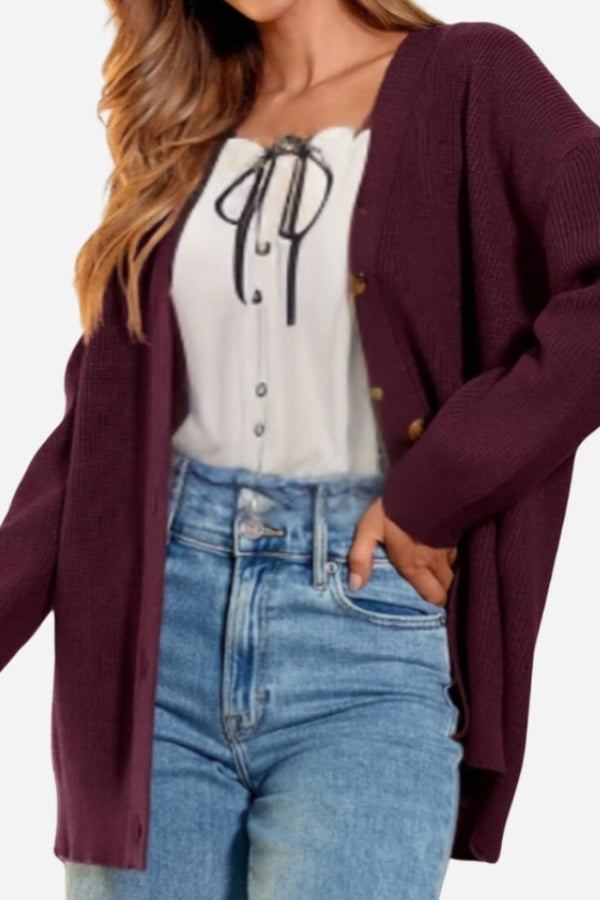 Relaxed fit oversized button down knitwear cardigan in burgundy worn with white blouse and blue jeans