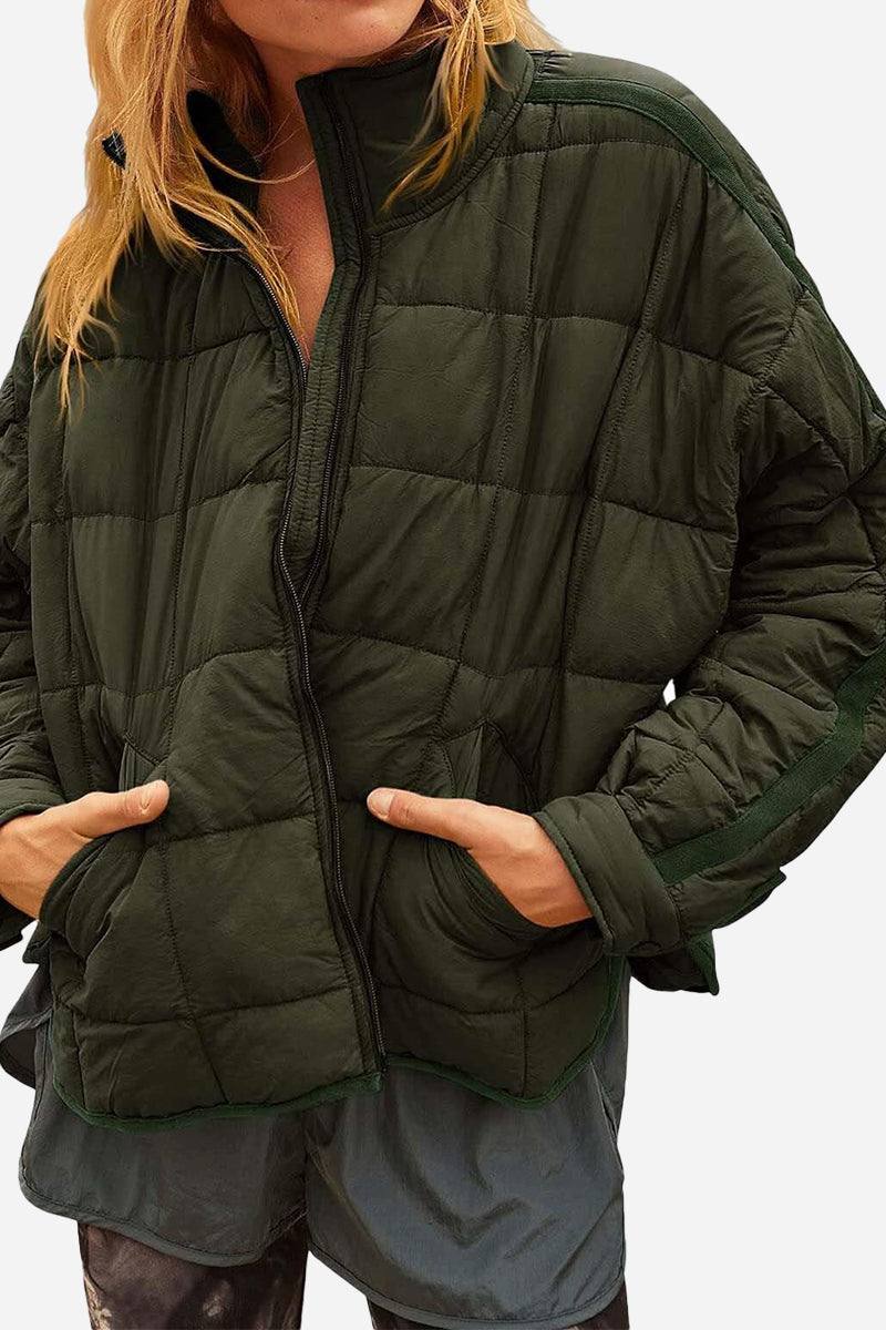 Lightweight puffer travel jacket in olive green with zip front and padded quilted design for versatile outdoor wear