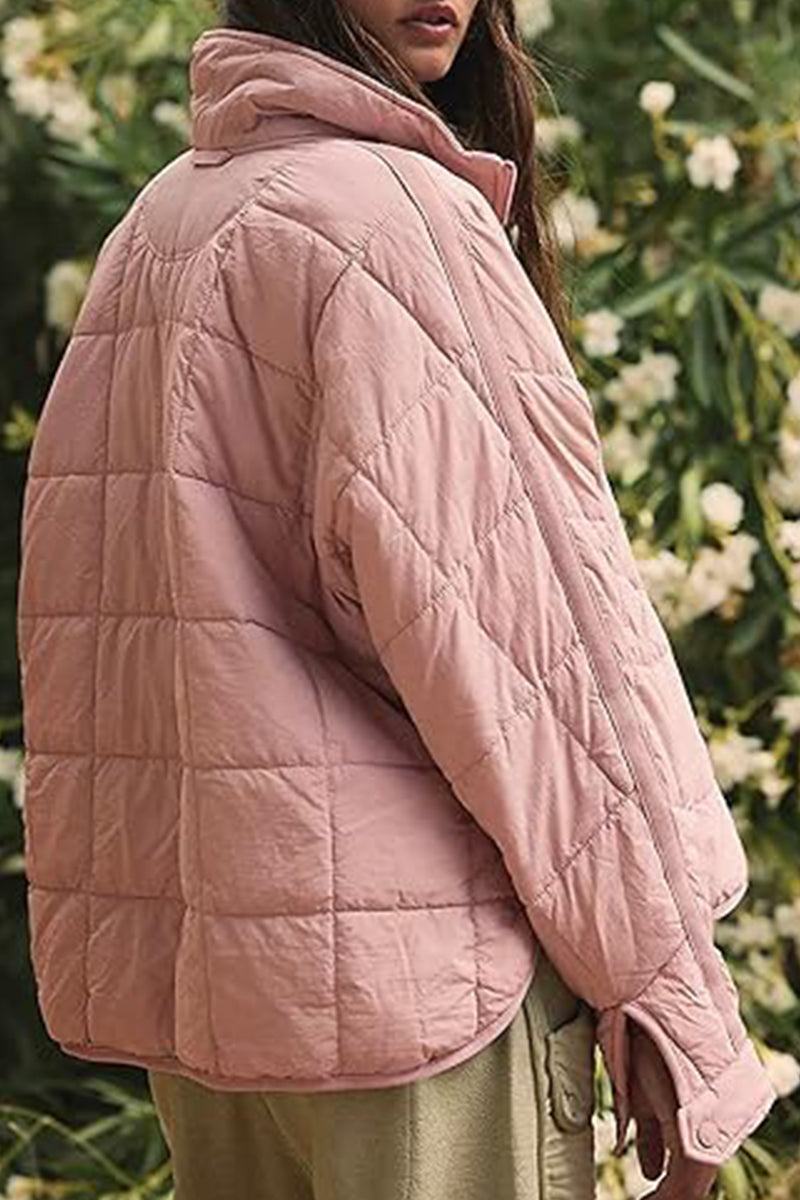 Lightweight pink puffer travel jacket for women, packable and warm, perfect for casual outdoor wear.