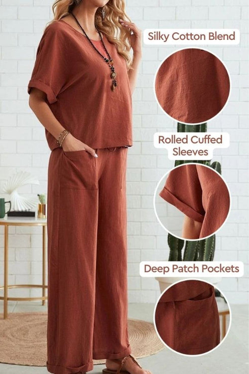 woman wearing rust-colored rolled cuff top with deep patch pocket pants set in silky cotton blend