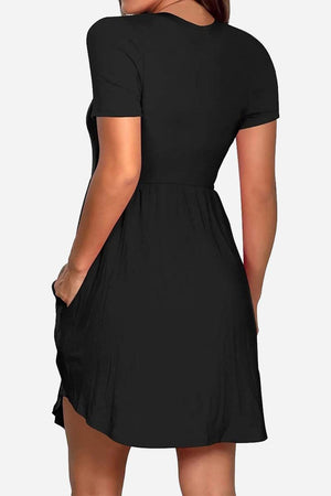 Black short-sleeved pleated dress with pockets and a cinched waist for a flattering hourglass shape