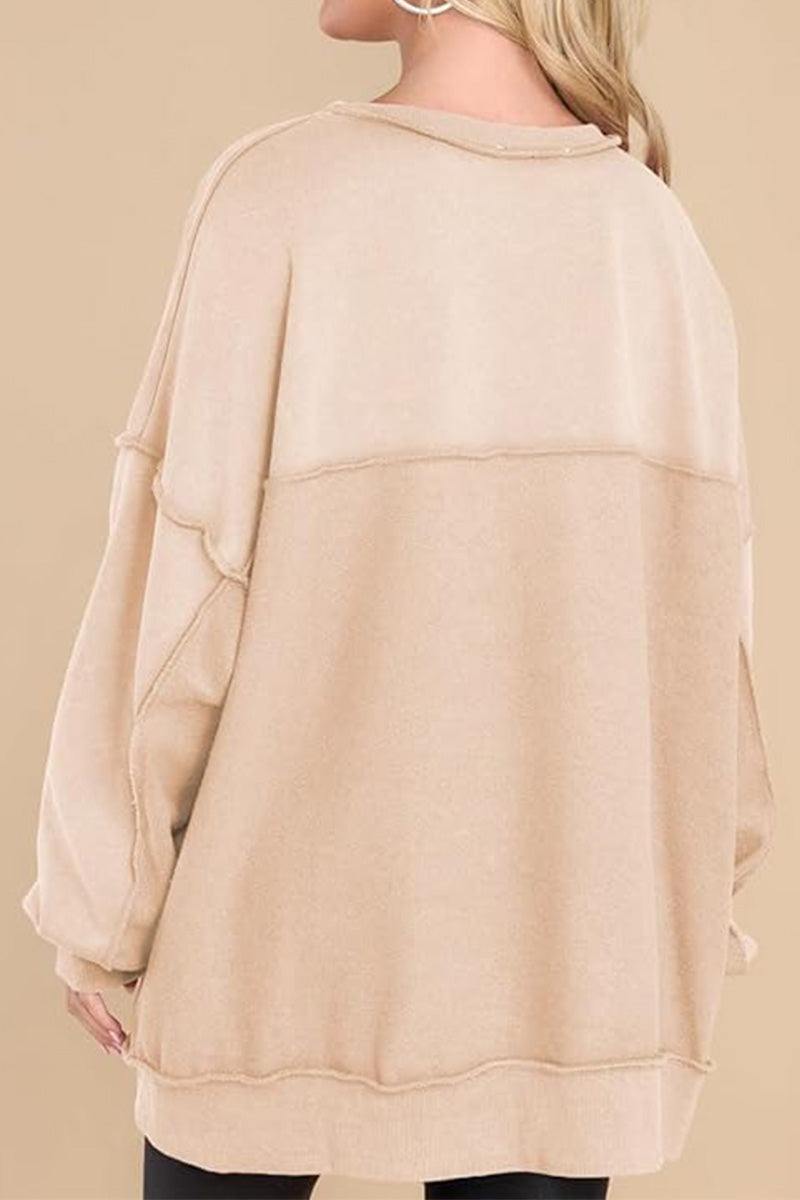 woman wearing beige oversized urban sweatshirt back view lightweight casual streetwear