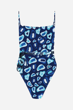 Tan-through open back one piece swimsuit in blue abstract pattern with adjustable straps and side tie detail