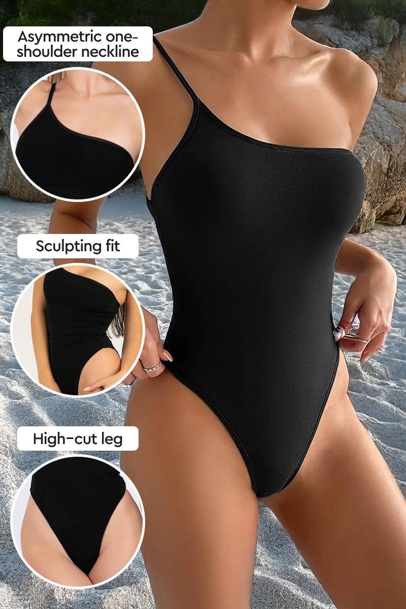Black asymmetric one-shoulder one-piece swimsuit with high-cut leg and sculpting fit, designed for an even tan without lines.