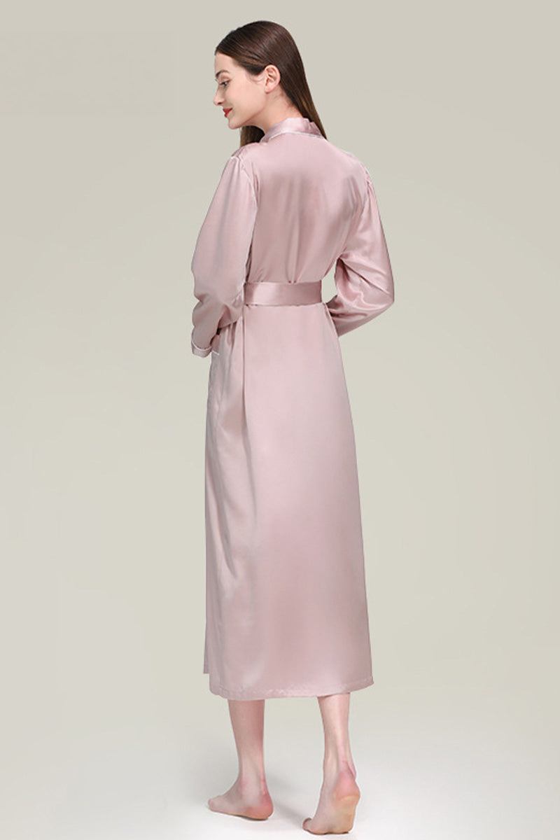 Back view of woman wearing blush pink Mulberry Silk Nightgown with sash belt and long sleeves