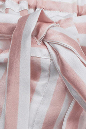 Close-up of 100% mulberry silk striped fabric in soft pink and white with a tied bow detail