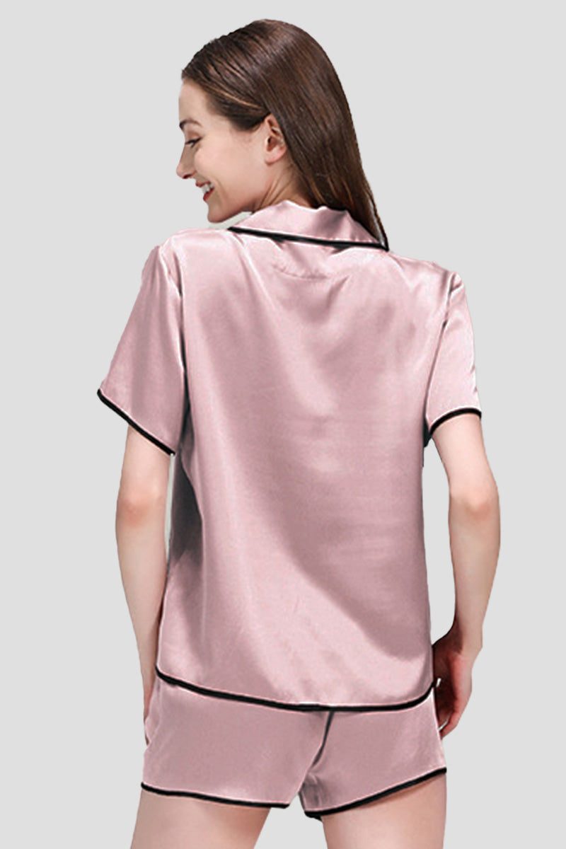 Back view of pink Mulberry Silk Hemd pajama set with black trim on model