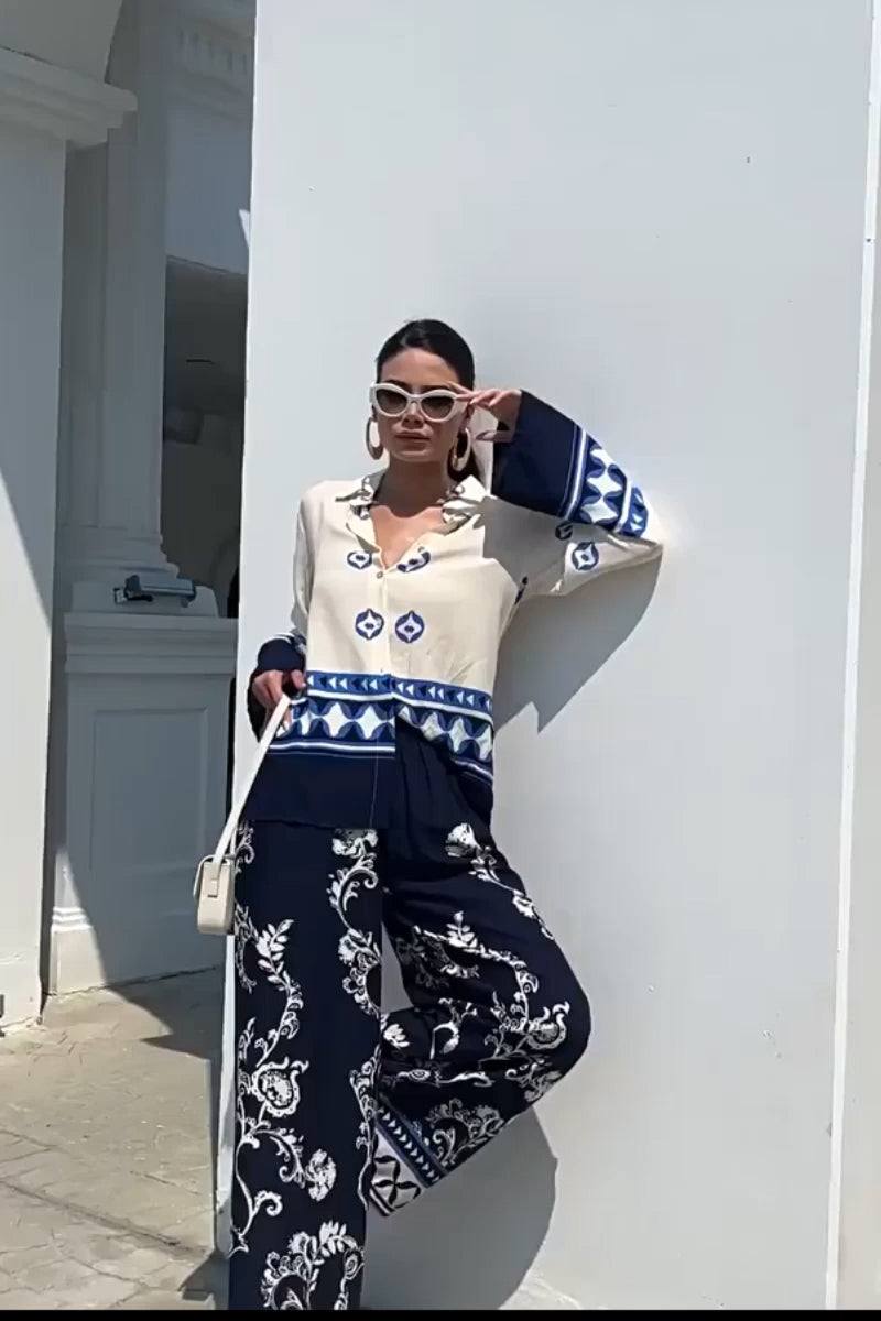 Woman wearing Mediterranean Two-Piece Set with blue and white porcelain-inspired prints, stylish and comfortable fit.