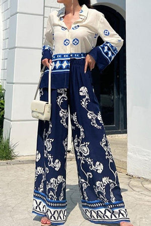 Mediterranean two-piece set women's outfit with blue and white porcelain print, long sleeve blouse and wide-leg pants.