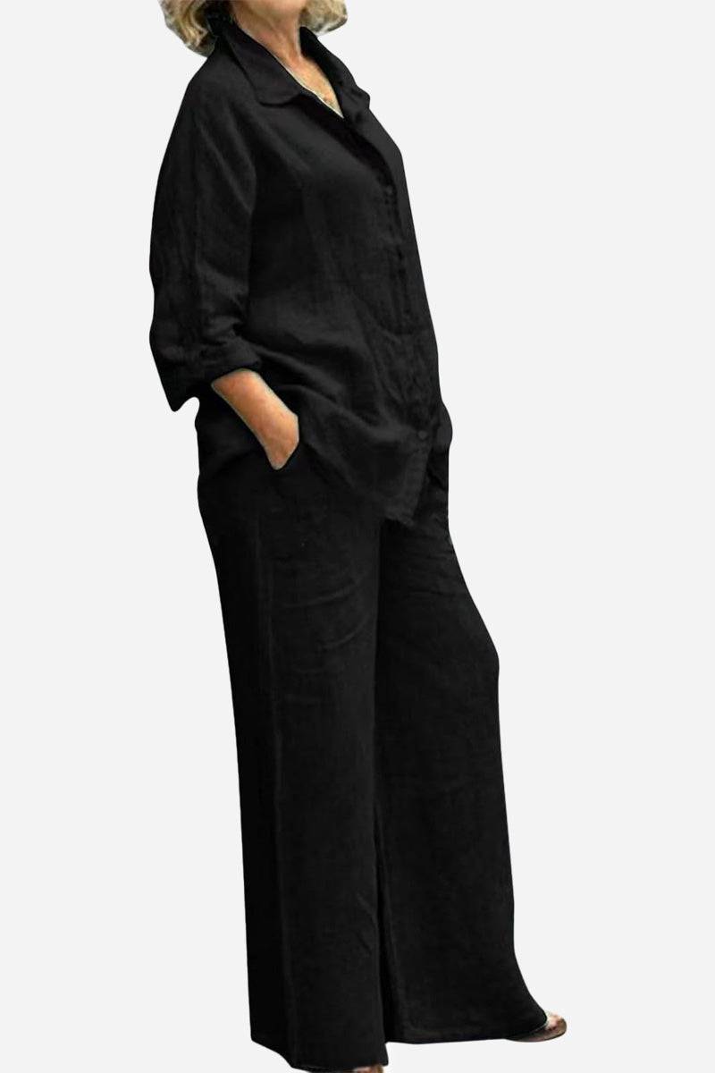 Black cotton blend two-piece set with relaxed fit and textured fabric.