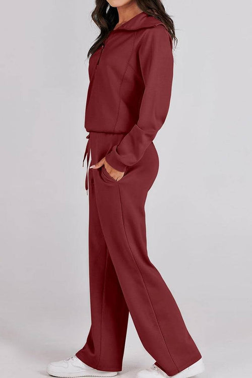 Woman wearing burgundy Loungewear Buttersoft Tracksuit Set with zip-up top and relaxed-fit pants.