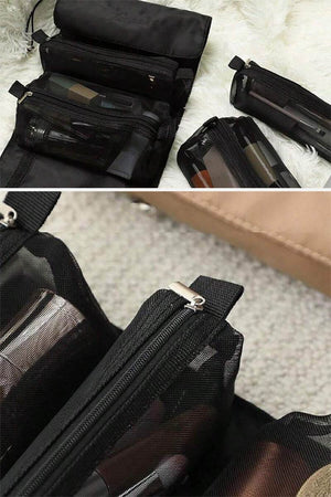 Compact black nylon travel makeup bag with multiple zippered compartments for organized cosmetics, water-resistant and durable for travel light look right style.