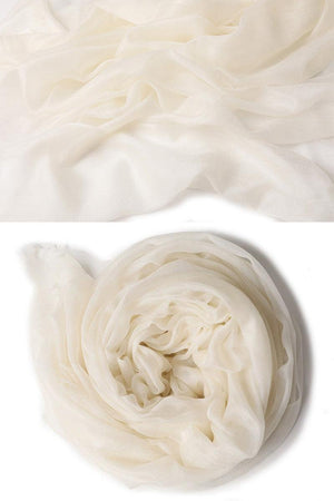 Soft white 100% cashmere featherlight luxury scarf, lightweight and warm with a smooth texture.