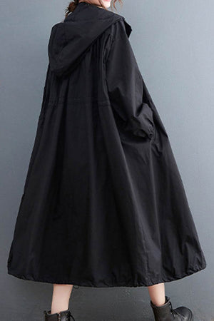 Black oversized all-weather water-resistant windbreaker with hood and roomy fit for versatile protection and comfort