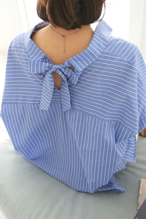 Back view of 100% cotton oversized striped blue shirt with bow detail on collar