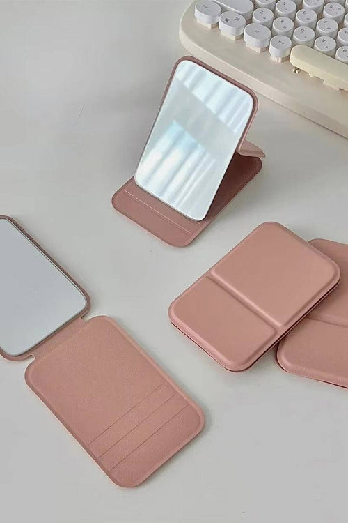 Compact travel pocket mirror with durable PU leather case in pink, lightweight and portable for on-the-go touch-ups.