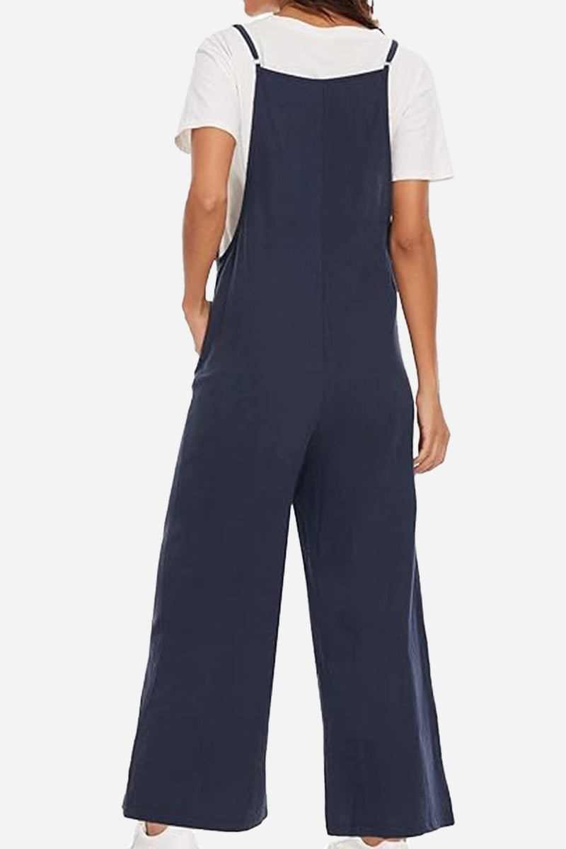 Woman wearing navy blue cotton blend comfort jumpsuit with wide legs and adjustable straps viewed from the back