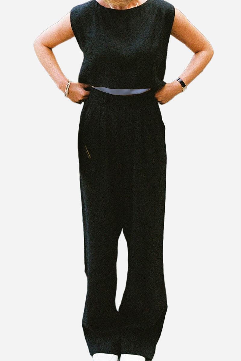 Woman wearing black cotton-linen blend sleeveless crop top and wide-leg pants two-piece summer outfit