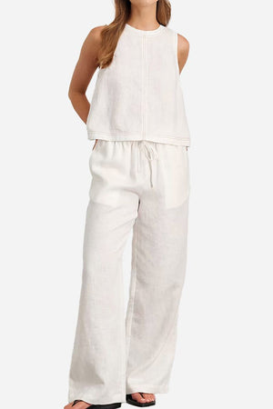 Cotton-linen relaxed two-piece set featuring sleeveless back-slit top and wide-leg pants in natural breathable fabric