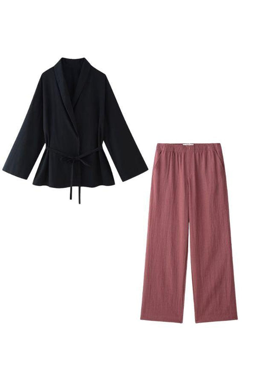 Black wrap top and dusty rose wide-leg pants mix-match lounge-to-travel set
