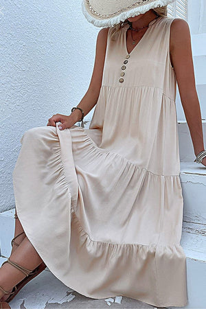 Bohemian tiered midi dress in beige with V-neck and button details, sleeveless and flowy summer style