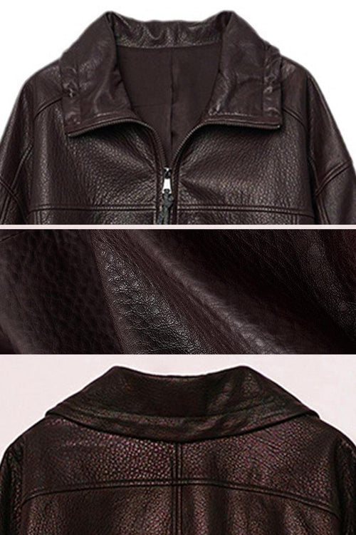 Close-up of dark brown genuine sheepskin leather jacket showing texture and collar details