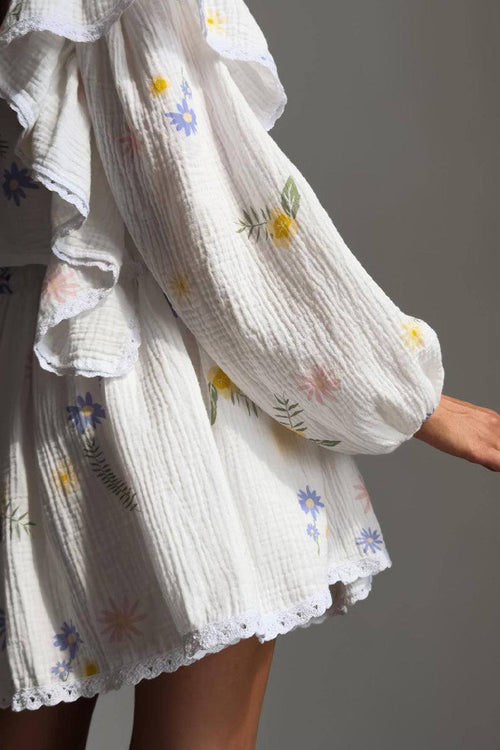 Close-up of a white ruffled cotton blouse with colorful floral prints from the Sweet Countryside 100 Cotton two-piece set