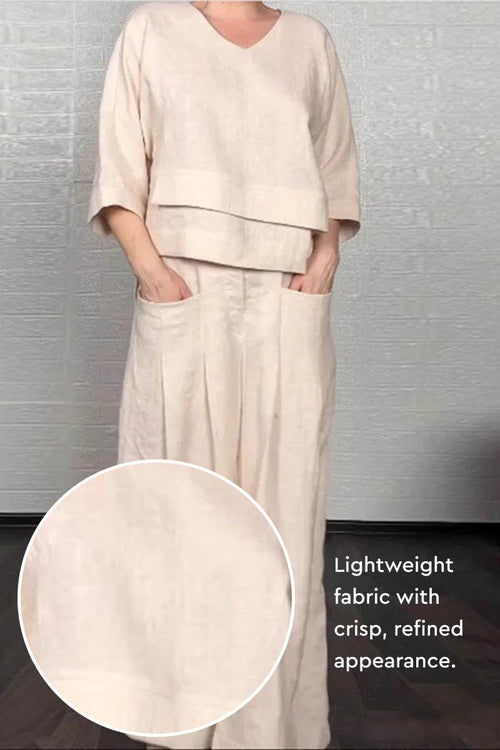 Atelier Serenity Layered Two-Piece Set featuring breathable, lightweight fabric with layered V-neck top and wide-leg trousers in a neutral tone.