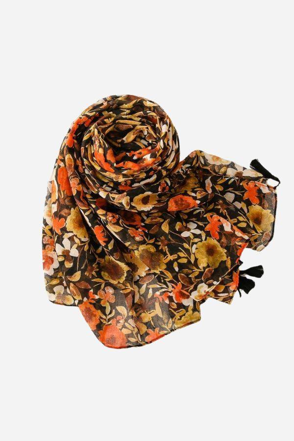 Twilight Blooms Scarf with warm floral print, featherlight drape, and tassel edges in autumn tones