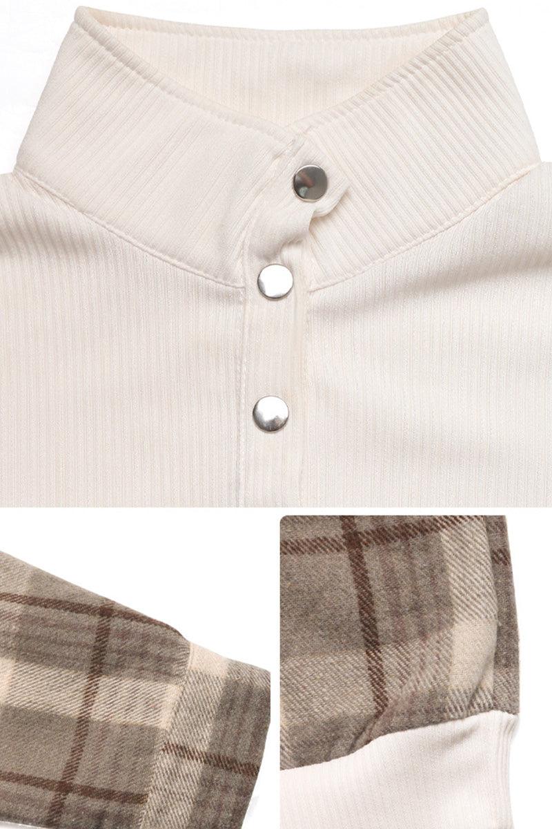 Close-up of waffle knit sweatshirt with button detail and plaid flannel sleeves in neutral tones