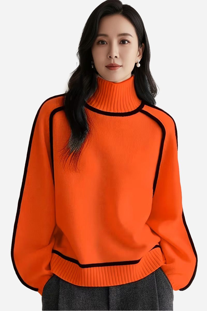 Orange Zero Itch Turtleneck Sweater with black trim, soft knit, and modern fit on woman