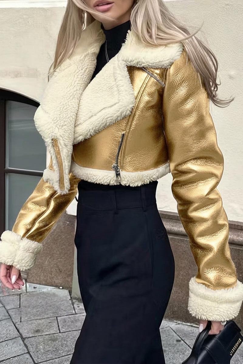 Cropped faux leather jacket with cream sherpa lining and trim, gold matte finish, and zipper front closure.