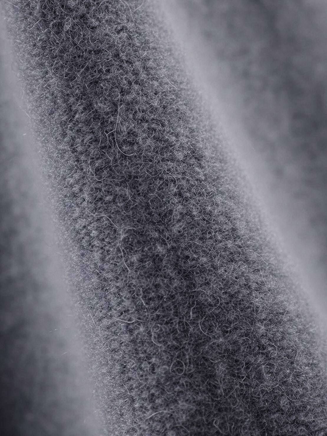 Woman wearing oversized polo knit loungewear set with soft collar and straight-leg pants