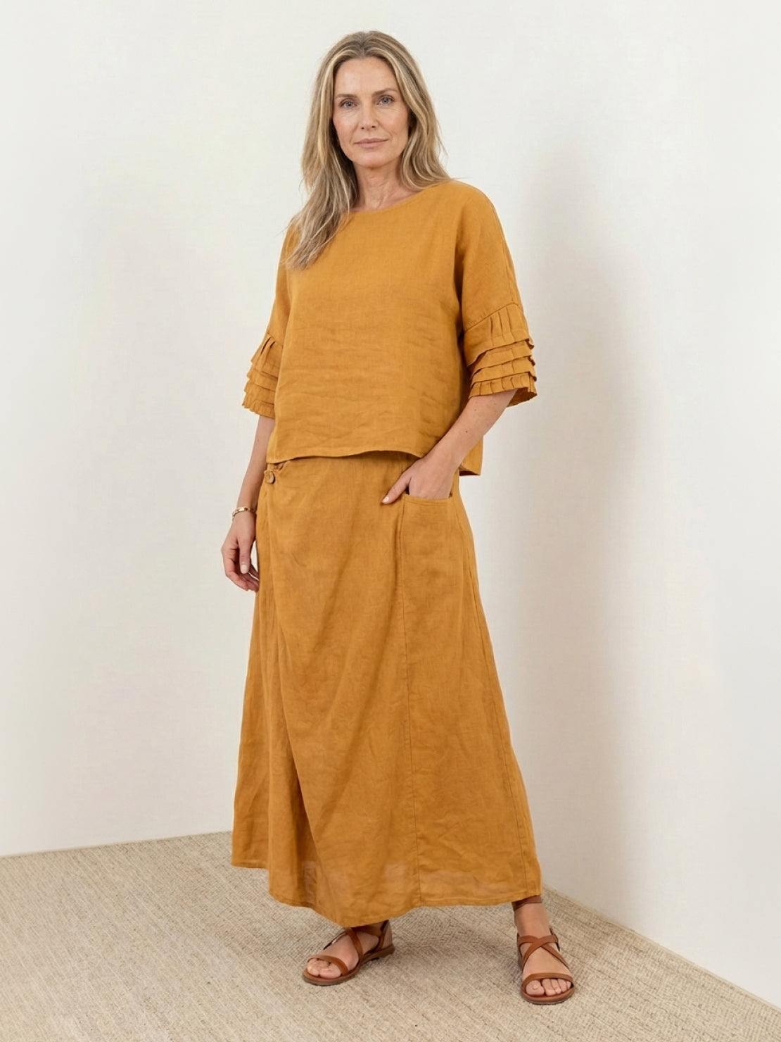 Two-piece 100% cotton wrap skirt and hip-length top set with crinkle texture and asymmetrical hem