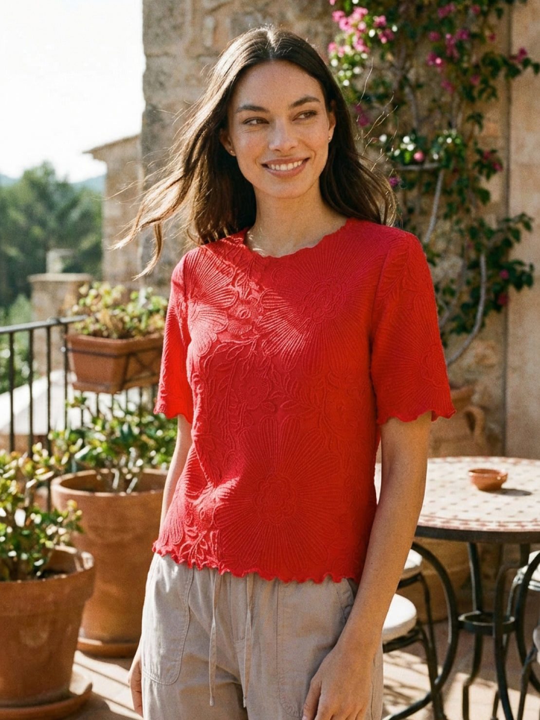 Floral jacquard pleated top with 3D floral texture, flutter sleeves, and relaxed A-line silhouette