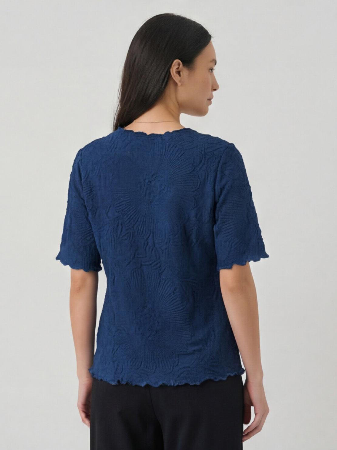 Floral jacquard pleated top with 3D floral texture, flutter sleeves, and relaxed A-line fit