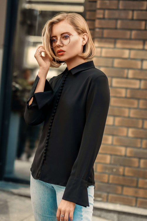 Black Bayam Blouse with button details worn by woman with glasses and blonde hair